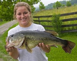 Audry Wiggins sporting a huge bass. Audry is a tour narrator at DCCI. 