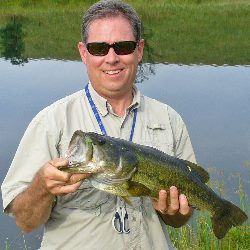 Chris Hunter with a bass captured at Dickinson Cattle Co Saturday morning at 9:30